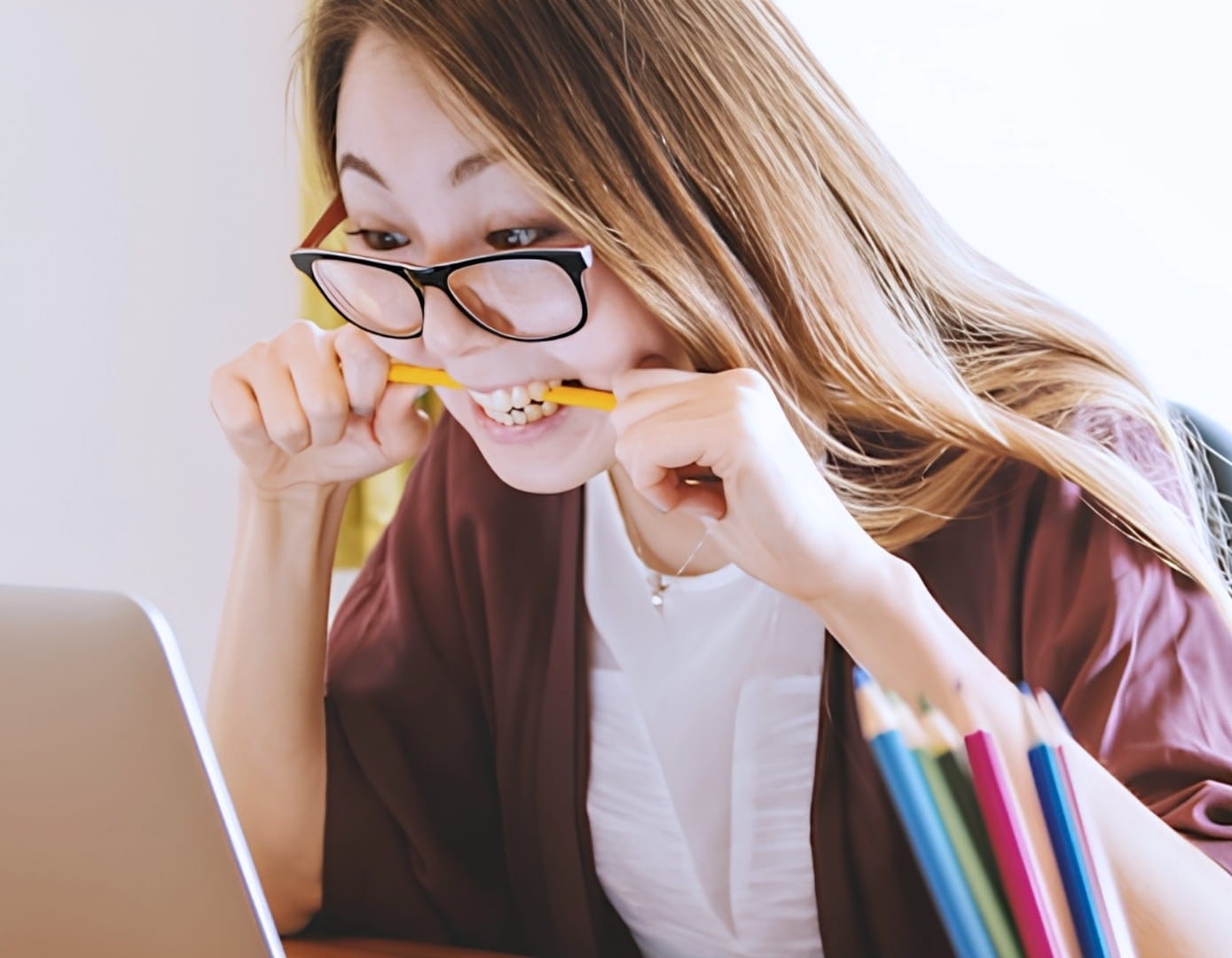 A stressed female student looking at her laptop