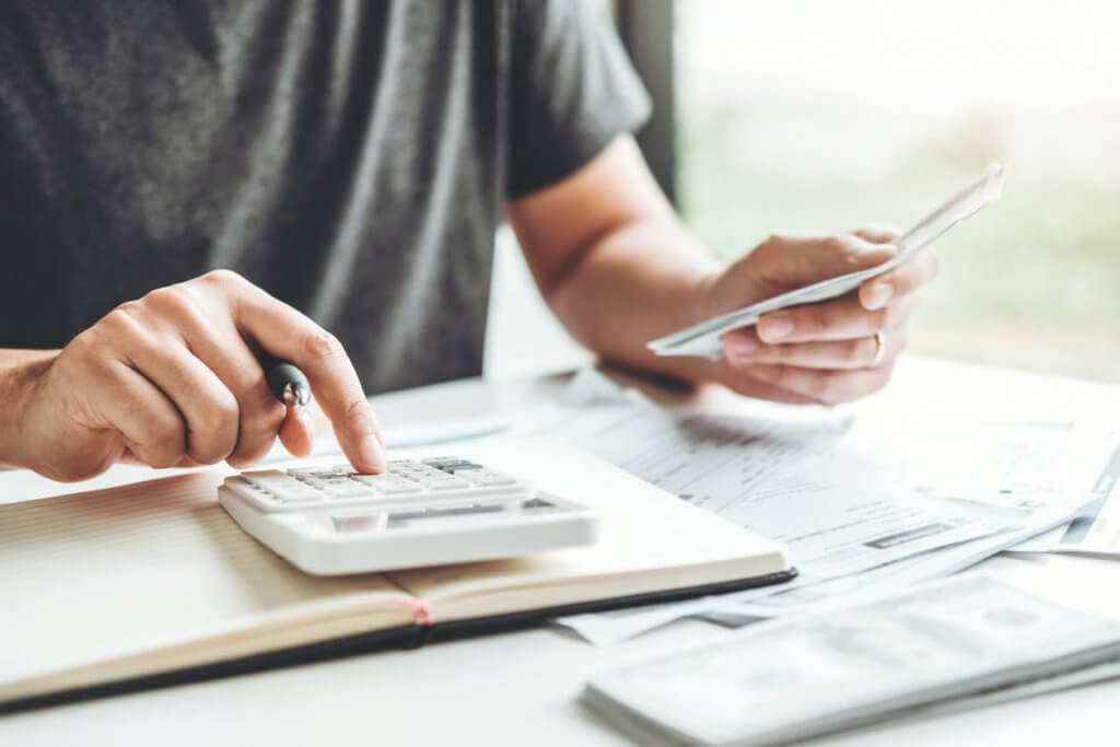 man using a calculator