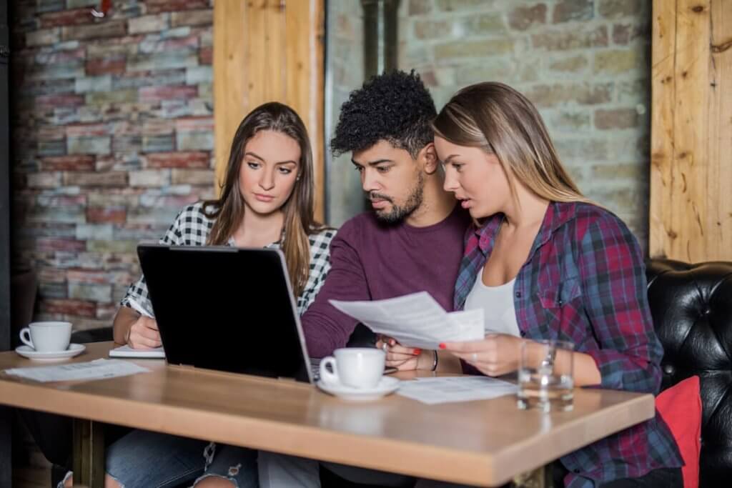 people doing research on a laptop