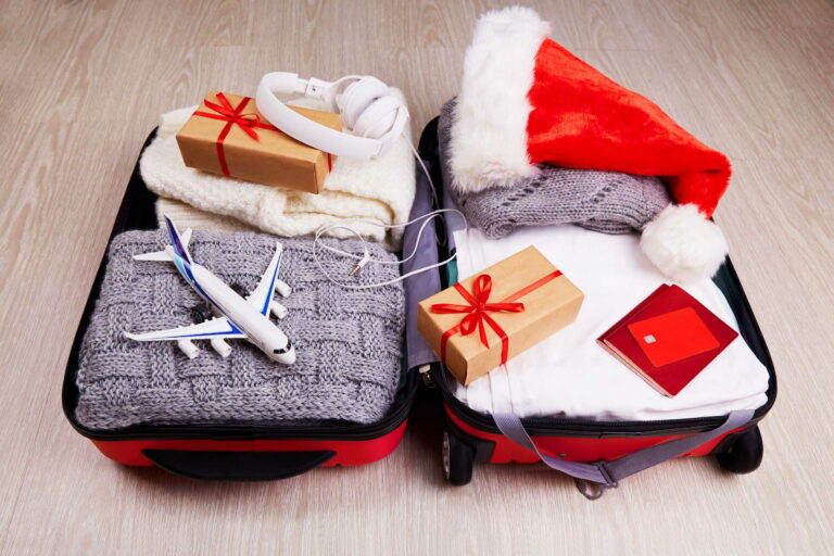 An open suitcase full of a student's Christmas belongings