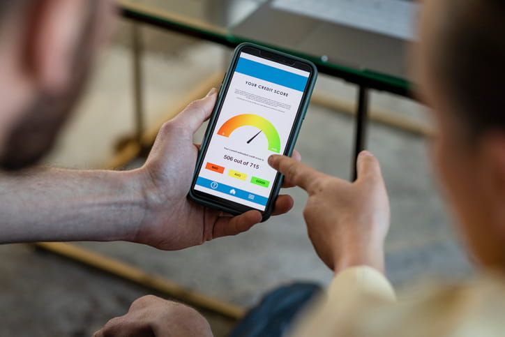 A student checking their credit score on their mobile phone